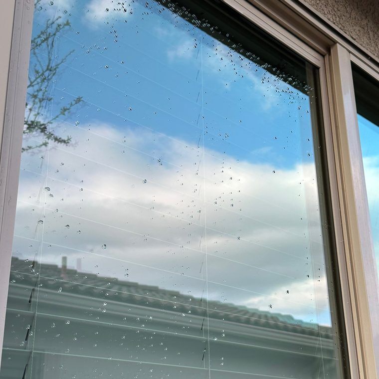 Streak-free window reflecting blue sky